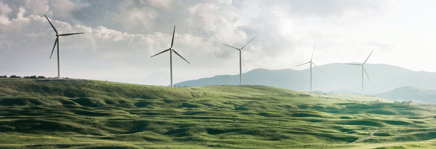 Wind turbines on a green hillside